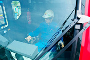 Mr. Nishitani in the cab with a set of tools, getting a feel for the controls.